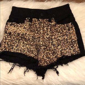 BDG gold sequin black high rise cheeky shorts